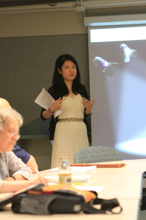 Asian woman delivering a presentation